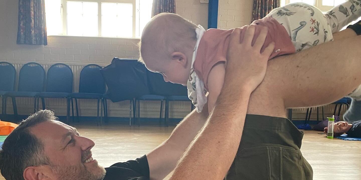 superhero baby and dad at baby college classes